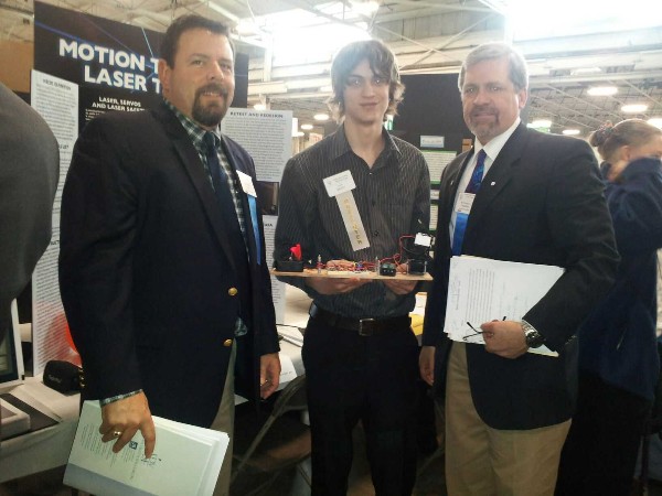 At the Delaware Valley Science Fair in April, Rachfalski (r) and Rob Corey (l), chapter senior vice president, present the chapter's first place prize to Heffernan for his project titled “Motion Tracking Laser Turret.”